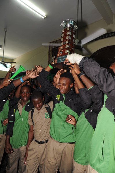 Norman Grindley/Chief Photographer
Calabar high school family celebrates at the school after their victory on Saturday at champs, March 18, 2013.