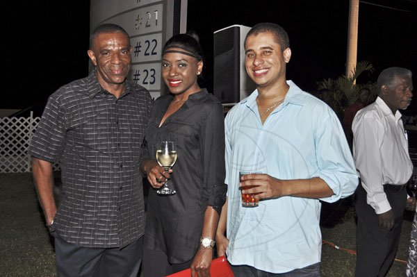 Janet Silvera Photo
 
From L- Audley Quarrie, Patrique Goodall and Nicholas Shaw share lens time at the unveiling of ATL Autohaus' 2012 Honda CRV at their Bogue industrial centre in Montego Bay last Thursday night