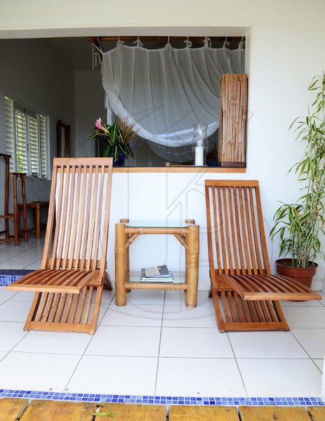 Gladstone Taylor / Photographer
Guests can relax on these teak wooden chairs and enjoy the beautiful ocean view from the deluxe room patio.

Hotel Mocking bird