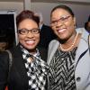CEO of American Chamber of Commerce - Gail Abrahams (left) enjoys the company of Donette Mills- Tax Administration of Jamaica as they share smiles with the camera.
