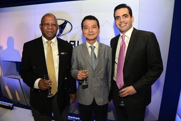 Carlos Geourzoung - sales Manager of Magna Motors (left) shares the lens with Taewon Choi - deputy General Manager, Central & South America Regional Headquarters, Hyundai Motor Company and Agustin Lama - board director of Magna, after the unveiling of the Hyundai insignia.