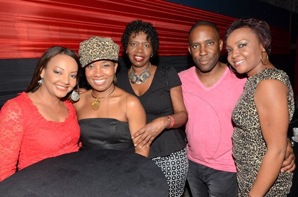 Rudolph Brown/Photographer
Mark Thompson, President and CEO of Advantage General pose his team left Ruth Cummings, Odia Reid, Adina Bryson and Alicia Knight at the Insurance Association of Jamaica Christmas in November red and black party at the Guardian Life car park in New Kingston on Saturday,  November15-2014.