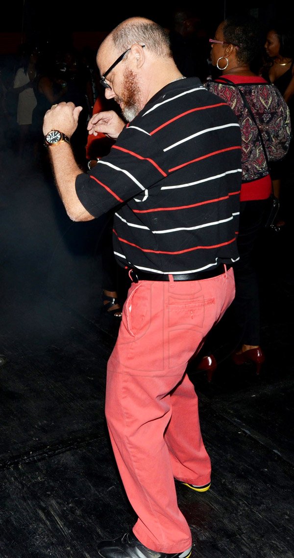 Rudolph Brown/Photographer
Peter Levy dancing at the Insurance Association of Jamaica Christmas in November red and black party at the Guardian Life car park in New Kingston on Saturday,  November15-2014.