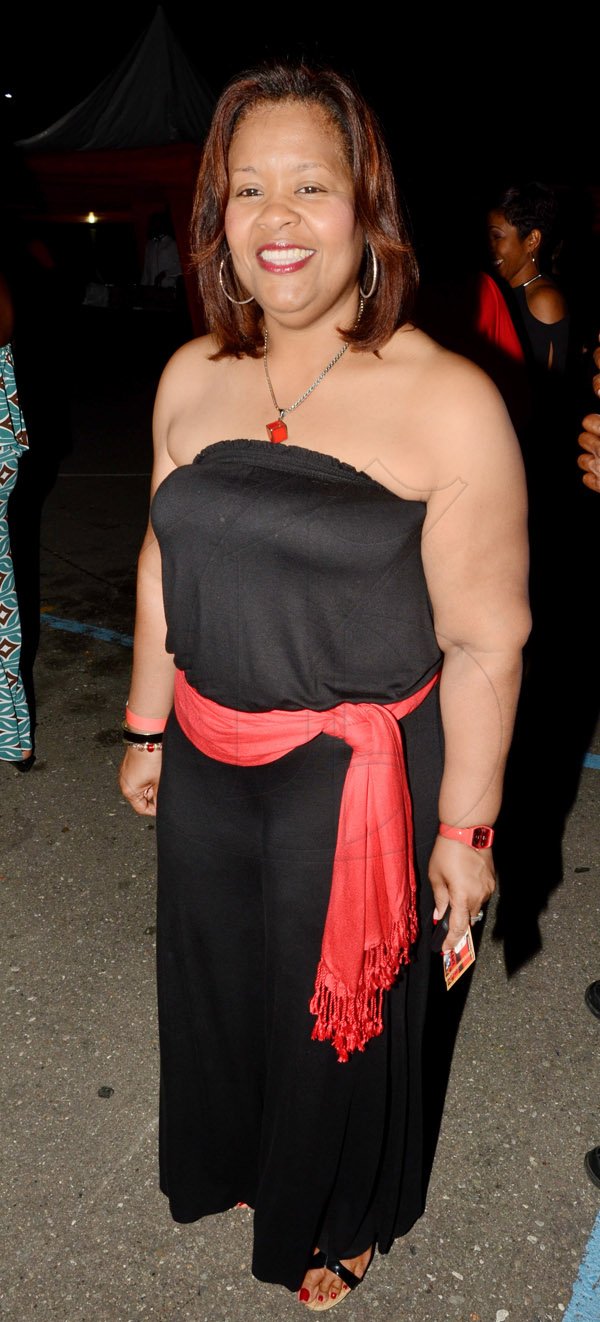 Rudolph Brown/Photographer
Jackie Hamilton of Scotia Insurance at the Insurance Association of Jamaica Christmas in November red and black party at the Guardian Life car park in New Kingston on Saturday,  November15-2014.