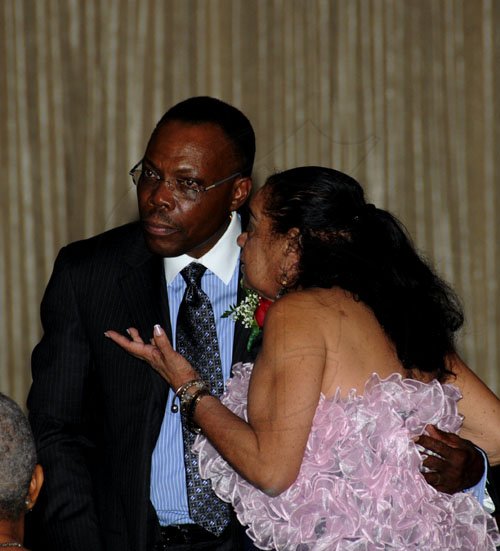 Winston Sill / Freelance Photographer
Ethlyn Norton-Coke has a word for George Willie at the Institute of Chartered Accountants of Jamaica (ICAJ) Annual Awards Dinner, held at the Jamaica Pegasus Hotel, New Kingston on Thjursday night December 1, 2011