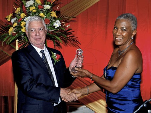 Winston Sill / Freelance Photographer
President of the Institute of Chartered Accountants of Jamaica (ICAJ) Vintoria Bernard presents Distinguished Member Award to Richard Downer at the Annual Awards Dinner, held at the Jamaica Pegasus Hotel, New Kingston on Thjursday night December 1, 2011