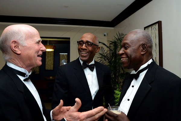 Winston Sill/Freelance Photographer
The Institute of Chartered Accountants of Jamaica (ICAJ) Annual Awards Banquet, for the presentation of ICAJ Distinguished MemberAward to Eric A. Crawford; and the Launch of 50th Anniversary Celebrations, held at the Jamaica Pegasus Hotelm New Kingston on Thursday night December 4, 2014.  Here are Jim Nurse (left); Earl Samuels (centre); and Rev. Jim Parkes (right).