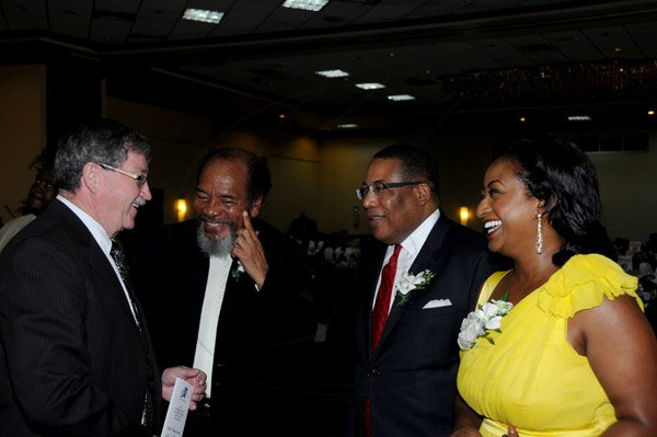 Winston Sill / Freelance Photographer
The Incorporated Masterbuilders Association of Jamaica (IMAJ) 60th Anniversary  Awards Banquet, held at the Jamaica Pegasus Hotel, New Kingston on Saturday night March 2, 2013. Here are Rick McElrea (left), Senior Trade Commissioner, Canadian Embassy; Carvel Stewart (second left), President, IMAJ; Minister Anthony Hylton (second right); and Mrs. Anthony Hylton (right).