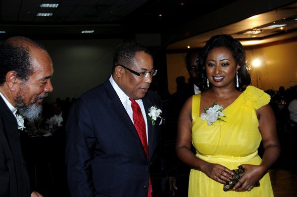 Winston Sill / Freelance Photographer
The Incorporated Masterbuilders Association of Jamaica (IMAJ) 60th Anniversary  Awards Banquet, held at the Jamaica Pegasus Hotel, New Kingston on Saturday night March 2, 2013. Here are Carvel Stewart (left), President, IMAJ; Minister Anthony Hylton (centre); and Mrs. Anthony Hylton (right).