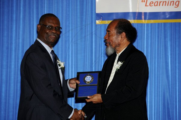 Winston Sill / Freelance Photographer
The Incorporated Masterbuilders Association of Jamaica (IMAJ) 60th Anniversary  Awards Banquet, held at the Jamaica Pegasus Hotel, New Kingston on Saturday night March 2, 2013.  Here are Hugh Burton (left), Immediate Past President; and Carvel Stewart (right), President, IMAJ.