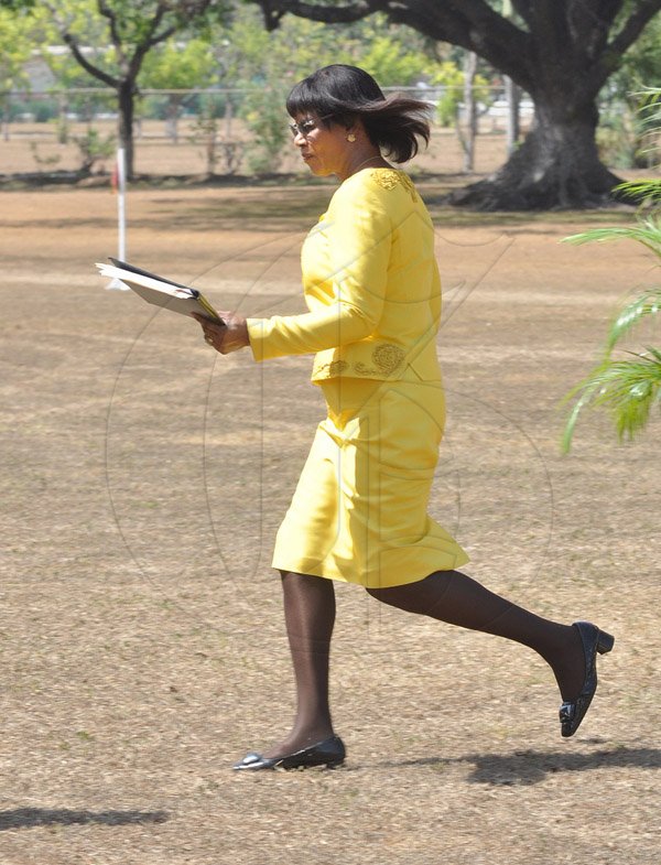 Jermaine Barnaby/Photographer
Prime Minister Portia Simpson Miller makes a run for it at the Annual Independence Day Ceremony at  King's House on Wednesday, August 6, 2014.