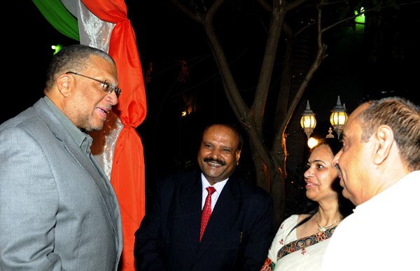 Winston Sill / Freelance Photographer
India High Commissioner to Jamaica Pratap Singh and wife Prem Lata Singh host a reception to mark the occasion of 64th Republic Day of India, held at India House, East King's House Road on Saturday night January 26, 2013.  Here are Minister Dr. Peter Phillips (left); High Commissioner Singh (centre); Prem Lata Singh (second right); and Lachu Ramchandani (right).