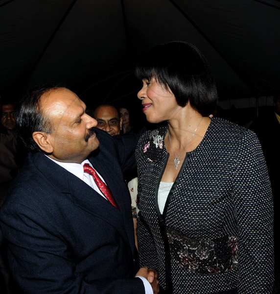 Winston Sill / Freelance Photographer
India High Commissioner to Jamaica Pratap Singh and wife Prem Lata Singh host a reception to mark the occasion of 64th Republic Day of India, held at India House, East King's House Road on Saturday night January 26, 2013. Here High Commissioer Singh (left) greets Prime Minister Portia Simpson-Miller (right) on her arrival.