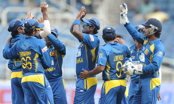 Ricardo Makyn/Staff Photographer
Sri Lanka's players celebrate a Wicket against India at Sabina Park on Tuesday 2.7.2013