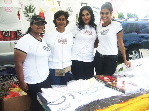 Paul Williams/Gleaner Writer
Roti Festival
Left to right: Christina Rambhajan, Barbara Persuad, Anuradha Maharaj and Rani Maharaj, were on hand to promote their 'Yaad Since 1845' T-shirt at the National Council for Indian Culture in Jamaica's Indian Arrival Day and Roti Festival on Sunday, May 6, at Chedwin Park, St Catherine.