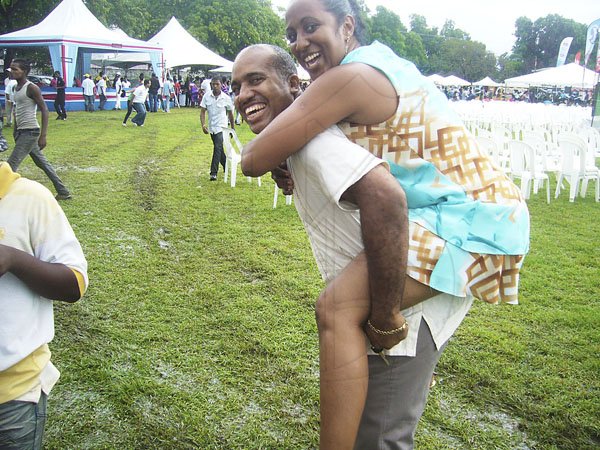 - Paul Williams

Whoii donkey! And who said chivalry is dead is a liar. Paul Gaynor keeps it alive as he navigates through the mud at the National Council for Indian Culture in Jamaica's Indian Arrival Day and Roti Festival on Sunday, May 6, at Chedwin Park, St Catherine.