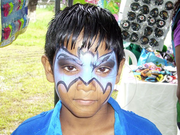 Paul Williams/Gleaner Writer
Roti Festival
Where is the fiend? Go get him 'Batman'. Suresh Maragh of Kingston had his face painted to reprise the role of the famous comic and movie hero at the National Council for Indian Culture in Jamaica's Indian Arrival Day and Roti Festival on Sunday, May 6, at Chedwin Park, St Catherine.