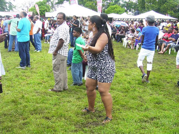 Paul Williams/Gleaner Writer
Roti Festival
The mud and the rain could not stop this patron from dropping legs at the National Council for Indian Culture in Jamaica's Indian Arrival Day and Roti Festival on Sunday, May 6, at Chedwin Park, St Catherine.