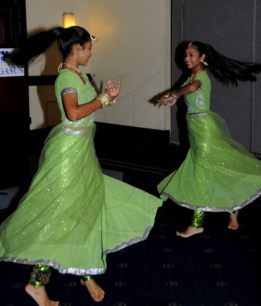 Winston Sill / Freelance Photographer
The National Council for Indian Culture in Jamaica host Cocktail Reception in honour of Vishu Tolan, held at Jamaica Pegasus Hotel, New Kingston on Sunday night March 3, 2013. Here are the Biersay sisters, Rachelle (left); and Chantelle (right) performing at the function.