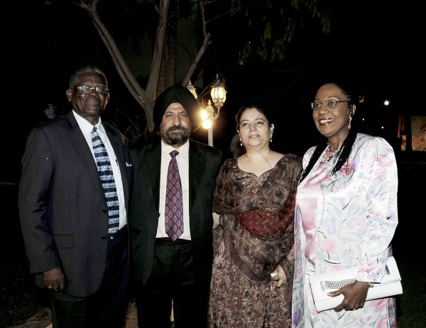 Winston Sill / Freelance Photographer
Outgoing Indian High Commissioner to Jamaica Mohinder Grover and his wife Vardeep Grover host their Farewell Reception, held at India House, East King's House Road on Friday night August 24, 2012. Here are Custos of St. Ann  Radcliffe Walters (left); High Commissioner Grover (second left); Vardeep Grover (second right); and Norma Walters (right).
