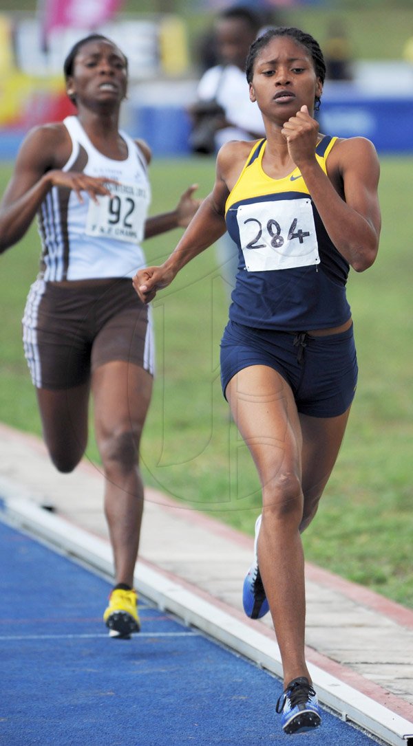 Ian Allen/Staff Photographer
Simoya Campbell right from Utech, winning the Women 1500m finals ahead of Roxcine Salmon of G.C.Foster College on the final day of the VMBS Intercollegiate Track and Field Championships 2014 at the UWI/Usain Bolt Track.