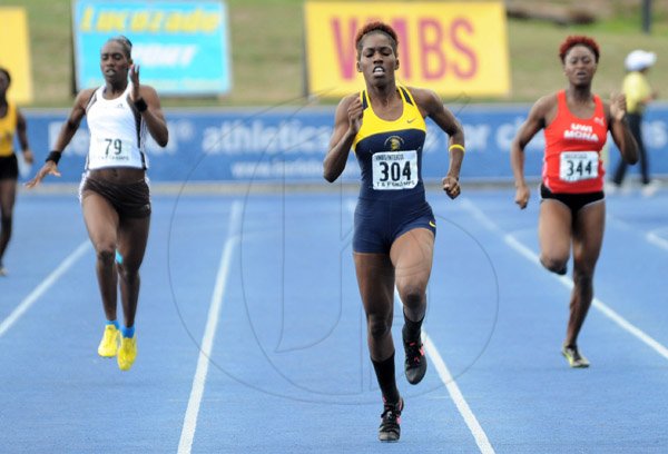 Ian Allen/Staff Photographer
Jenieve Russell centre from Utech winning the women 400m finals ahead of Rushell Clayton right from UWI and Samantha Curtis from G.C.Foster College during the  VMBS Intercollegiate Track and Field Championships 2014 at the UWI/Usain Bolt Track.