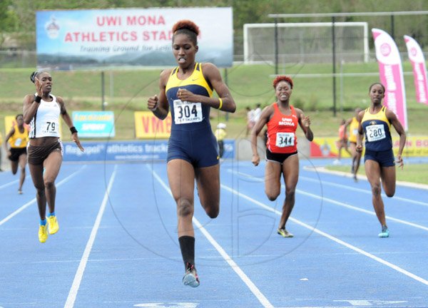 Ian Allen/Staff Photographer
Jenieve Russell second left, from Utech winning the women 400m finals ahead of Rushell Clayton second right from UWI, Venicha Baker right, Utech and  Samantha Curtis left, from G.C.Foster College during the  VMBS Intercollegiate Track and Field Championships 2014 at the UWI/Usain Bolt Track.