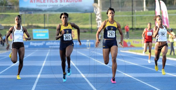 Ian Allen/Staff Photographer
Natasha Morrison second right, Utech winning the Women's 200m finals ahead of her teammate Elaine Thompson second left, Kedisha Dallas left from G.C.Foster College and Audra Segree right from G.C.Foster College during the VMBS Intercollegiate Track and Field Championship 2014 at the UWI/Usain Bolt Track.