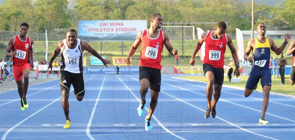 Ian Allen/Staff Photographer
Delano Williams centre from UWI winning the Men's 200m finals ahead of his teammate Jason Young second right, Tyquendo Tracey right from Utech, Everton Clarke second left from G.C.Foster College and Demish Gayle left from Knox College. Ocassion was the VMBS Intercollegiate Track and Field Championships 2014 at the UWI/Usain Bolt Track.
