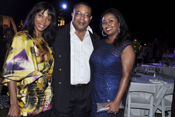 Janet Silvera Photo
 
From L- Lorna Johnson, and Minister of Industry, Investment and Commerce, Anthony Hylton and his wife Yodit at the final night function of the Jamaica Investment Forum at the Rose Hall Great House last Thursday night in Montego Bay.