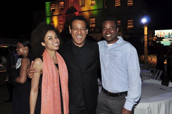 Janet Silvera Photo
 
Lynn Harrison (centre) and his children Angel (left) and Asa at the final night function of the Jamaica Investment Forum at the Rose Hall Great House last Thursday night in Montego Bay.