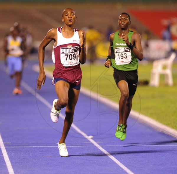 Ricardo Makyn/Staff Photographer
Rayon Butler of Holmwoood  wining the Boys'   Class 3  Girls 1500 Meters  Final   at the Boys and Girls Championships at the National Stadium on Friday 30.3.2012