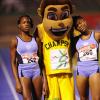 Ricardo Makyn/Staff Photographer
Left Marleena  Eubanks of Edwin Allen wininer  the Girls   Class 2  Girls 1500 Meters is congratulated with Teammate Sanikee Gardner by Champsy   at the Boys and Girls Championships at the National Stadium on Friday 30.3.2012