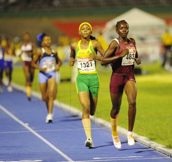 Ricardo Makyn/Staff Photographer
Lisa Buchannan of Holmwood wininer of  the Girls   Class 3  Girls 1500 Meters Final   at the Boys and Girls Championships at the National Stadium on Friday 30.3.2012