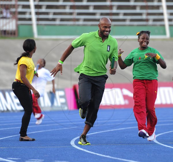 Ricardo Makyn/Staff Photographer
Asafa Powell participating in the   openning ceremony  at the Boys and Girls Championships at the National Stadium on Friday 30.3.2012