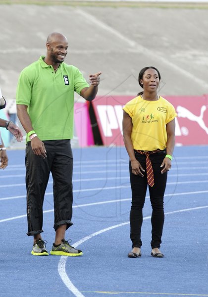 Ricardo Makyn/Staff Photographer
Asafa Powell and Shelly-Ann Frazer-Pryce  at the openning ceremony  at the Boys and Girls Championships at the National Stadium on Friday 30.3.2012