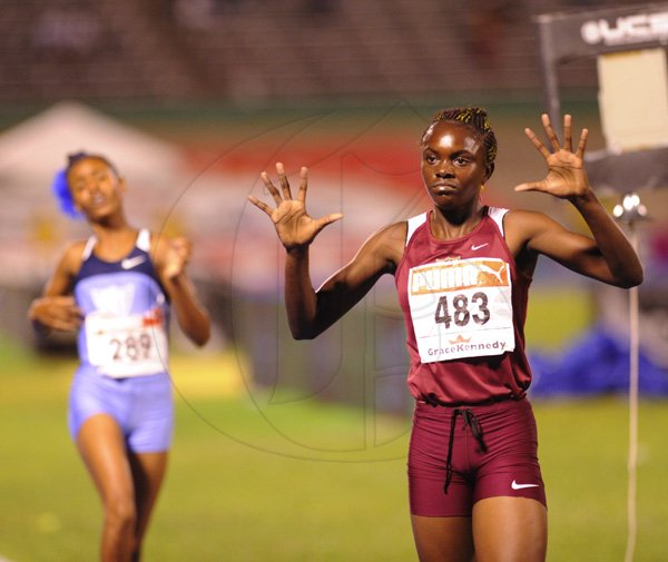 Ricardo Makyn/Staff Photographer
Lisa Buchannan of Holmwood wining the Girls   Class 3  Girls 1500 Meters  Final   at the Boys and Girls Championships at the National Stadium on Friday 30.3.2012