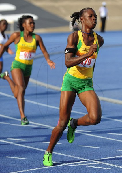 Ian Allen/Photographer
Shericka Jackson of Vere Technical winning heat 1 of the Class 1 Girls 200m on day two of Champs 2013.
