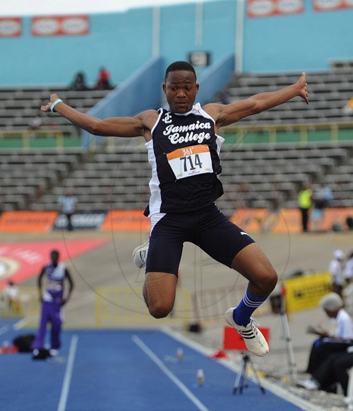 Ian Allen/Photographer
Ajani James of Jamaica College winning the Class 2 Long Jump at on Day two of Champs 2013.
