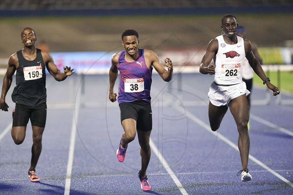 x *** Local Caption *** @Normal:Jaheel Hyde (centre) winning the men's 400 metres hurdles title just ahead of Kemar Mowatt (right). Both were awarded the same time, 48.53.   Ricardo Cunningham (left) was third in 48.83.