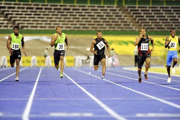 Ricardo Makyn 
Yohan Blake (left) powering home late to finish ahead of Michael Frater (right) during the quarter-finals of the men's 100m at the JAAA/SVL National Senior Championships inside the National Stadium last night. Blake won in a wind-aided 9.83 seconds with Frater  second in 9.86. Oshane Bailey (centre) was fourth in 10.11.