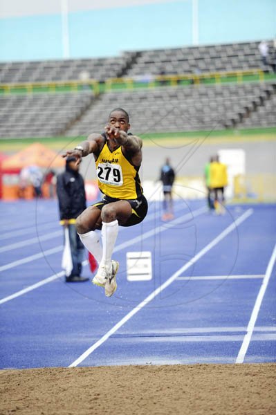 Ricahro Makyn/Staff Photographer
Nicholas Thomas soars on his final jump that measured 16.12 metres, to win the men's men's triple jump final, at the Jamaica Athletics Administrative Association/Supreme Ventures Limited National Senior Championships, at the National Stadium last night.