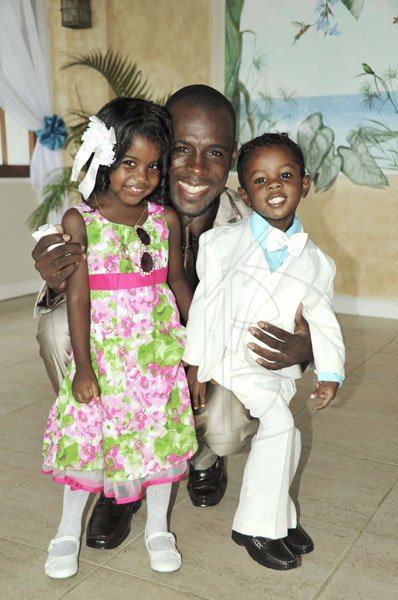 Mark Titus 


Jah Cure's Brother Micheal McBean with his daughter Micheala and son Micha.
