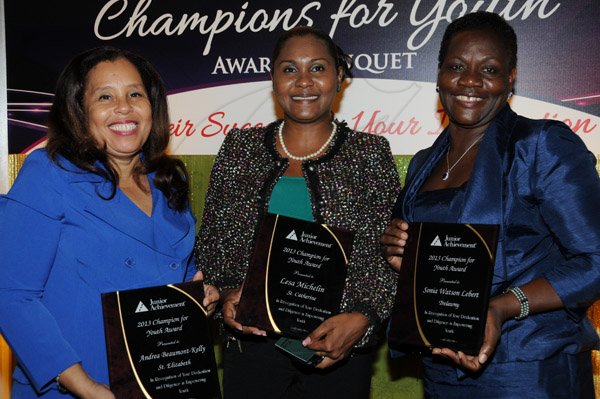 Winston Sill/Freelance Photographer
Junior Achievement Jamaica (JAJ) Champions for Youth Awards Banquet, held at the Terra Nova All-Suite Hotel, Waterloo Road on Thursday May 30, 2013. Here are Andrea Beaumont-Kelly (left), St. Elizabeth Technical High School; Lesa Michelin (centre), Ascot High School; and Sonia Watson-Lebert (right), William Knibb High School.