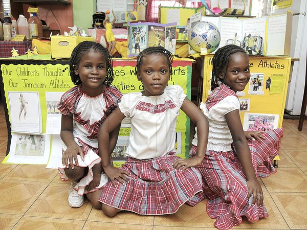 Gladstone Taylor / Photographer

grade 1 students Fantasia Fobes, Aliya Ebanks and Gabrielle Newby stand before the grade 1  jamaica day display

Jamaica day celebrations at new providence primary school, barbican roard, kingston