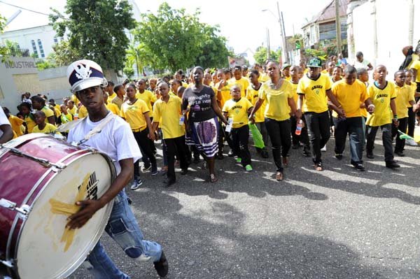 Norman Grindley / Chief Photographer
A member of the Steppers marching band leads the way on Duke Stree,t as they celebrate Jamaica day in Kingston, February 17, 2012.