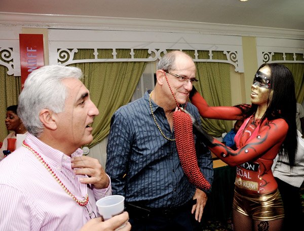 Winston Sill / Freelance Photographer
Bacchanal Jamaica official launch of the 2013 Carnival Season under the theme "Le Masquerade", and willmark the 25th Anniversary of Carnival, held at Knutsford Court Hotel, Ruthven Road on Tuesday night January 29, 2013. Here are Michael Ammar (left0; Ed Khoury (centre), Directors of Bacchanal Jamaica; and Ashleigh Miller (right).