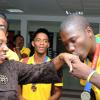 Ian Allen/Photographer
Johnathan Reid (right) gold medalist in the high jump at the just-concluded Carifta Games, kisses the hand of Minister of Sports and Culture Olivia Grange when she greets them at the airport.