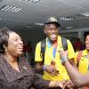 Ian Allen/Photographer
Minister of Sports and Culture Olivia Grange left shares a joke with members of the Jamaica Carifta Games team shortly after their arrival in the Island from the just concluded games in the Cayman Islands.