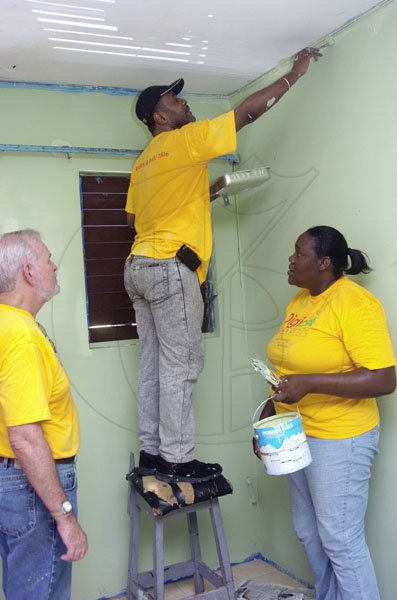 Ian Allen/Staff Photographer
Members of the Digicel Foundation and Staff helps to paint sections of the Hunts Bay Police Station as their Labour Day project.